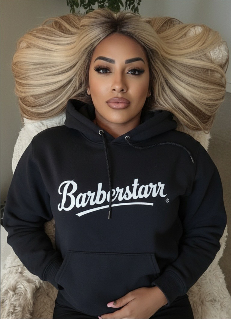 man posing with barberstarrs hoodie and hat